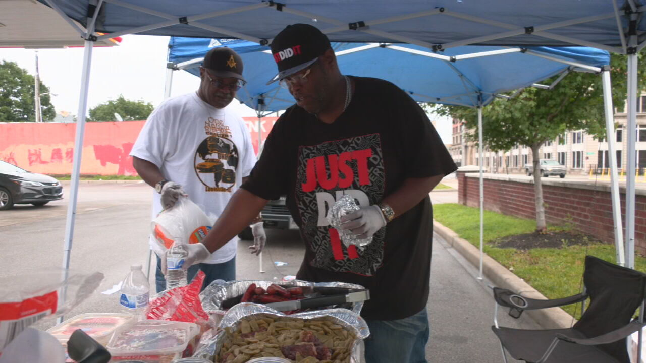 Members of One Nation Riders pass out food to residents of Louisville
